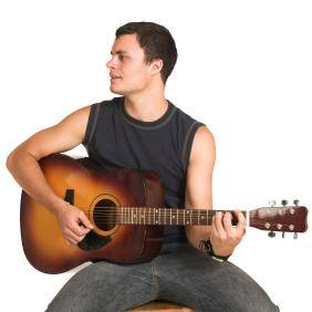 How To Hold An Acoustic Guitar While Sitting